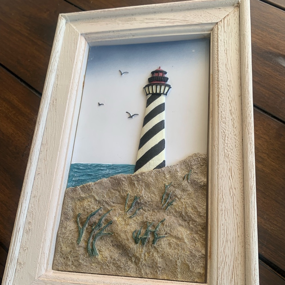 3 framed lighthouse art